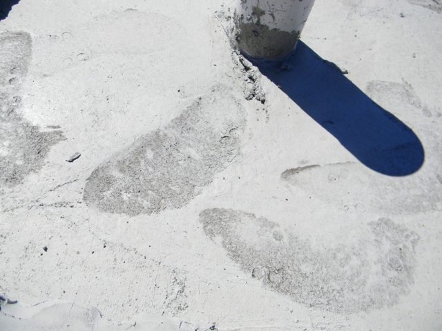 Footprints in shower recess concrete